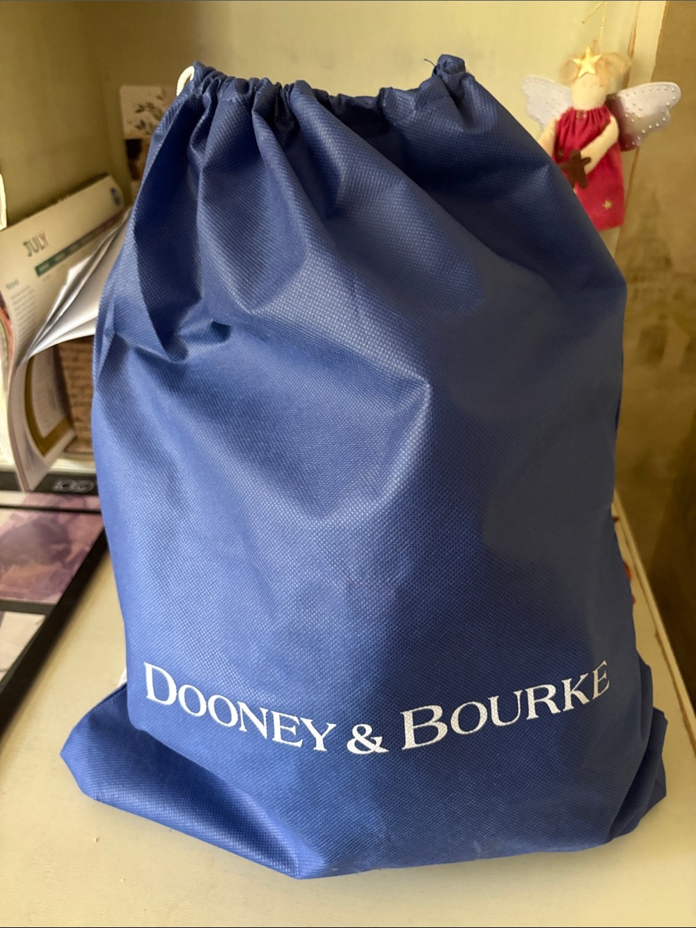 Dooney & Bourke Cream Leather Crossbody with Brown Trim and Toggle Closure - Picture 9 of 9